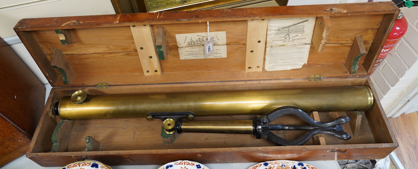 A 19th century brass telescope by Yeates & Son, Dublin, with integral brass and cast iron stand, in a pine case with labels to the inside of the lid, case 102cm long, 23cm deep, 13.5cm high. Condition - fair, splits to t